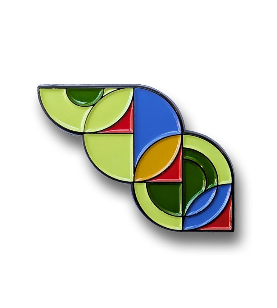 Pin with colorful geometric design on a white background