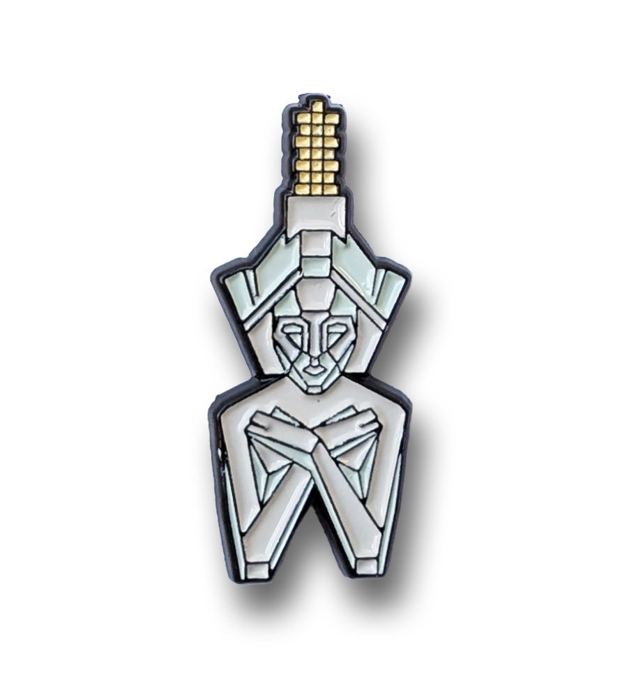 Pin of geometric statue with a white background