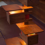 Close up of Taliesin Floor Lamp, cherry stain, with lights on