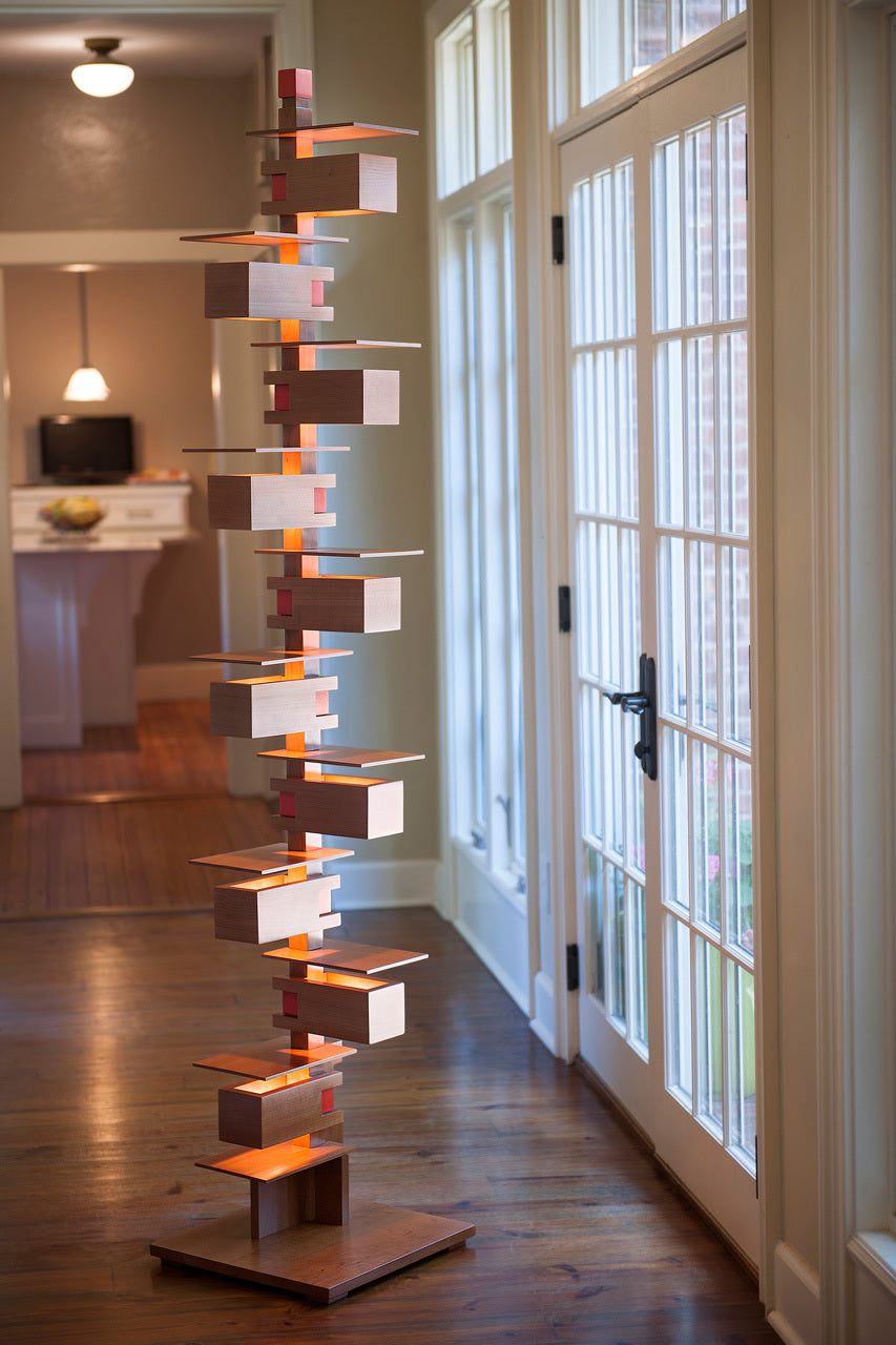 Taliesin Floor Lamp, cherry stain, in home setting.