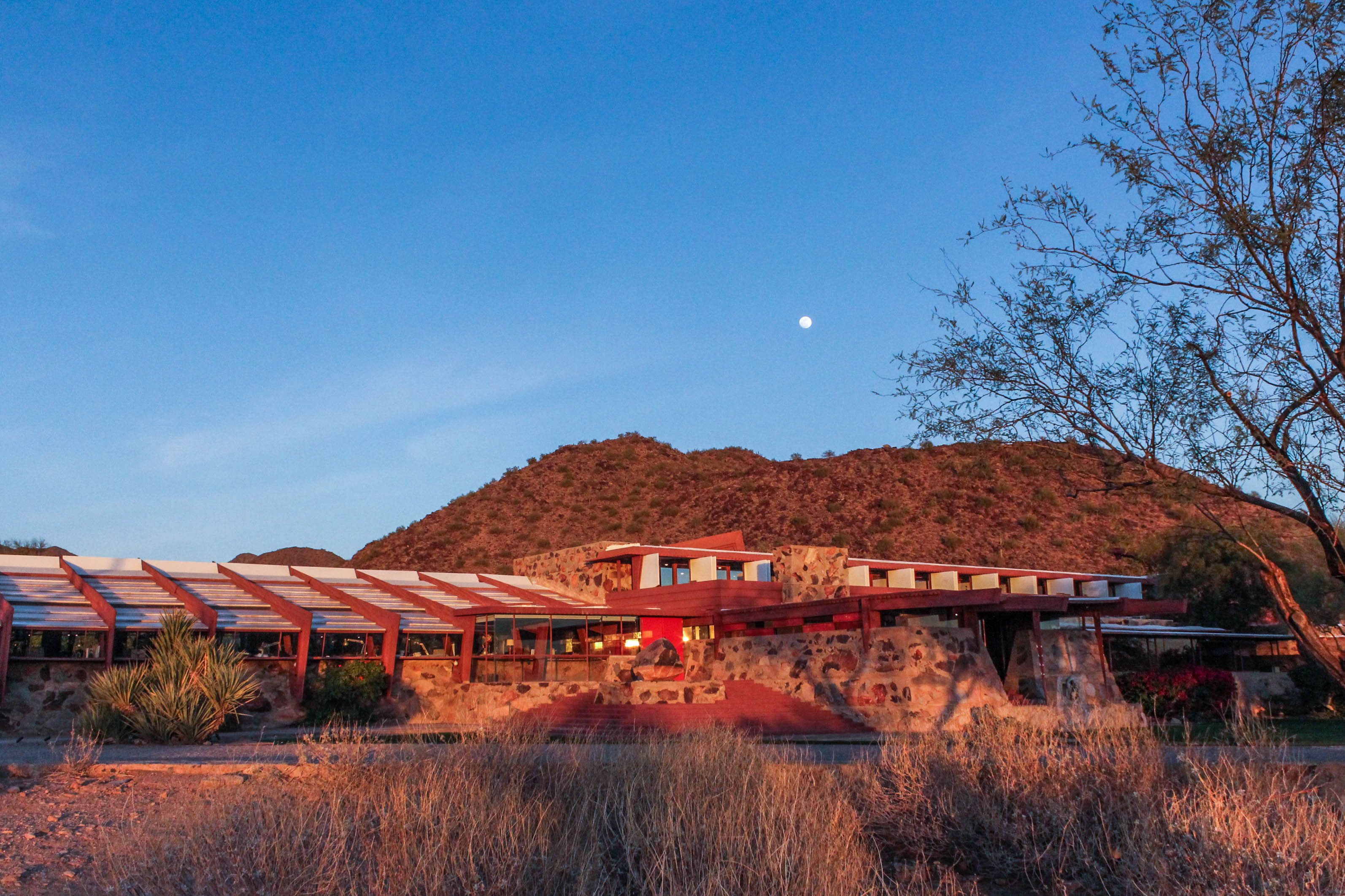 A view of Taliesin West exterior at sun down.