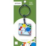 Keychain with colorful design on a green and white packaging