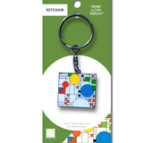 Keychain with colorful design on a green and white packaging