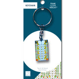 Keychain packaging with a geometric design on a white background