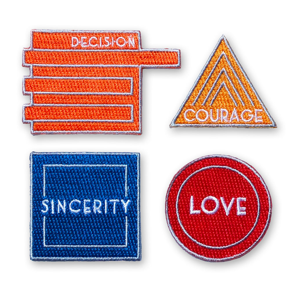 Set of four motivational patches with text on a white background