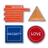 Set of four motivational patches with text on a white background