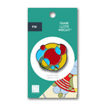 Colorful pin on a Frank Lloyd Wright branded packaging