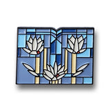 Decorative pin with floral design on a white background