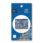 Pin with Frank Lloyd Wright design on a blue packaging