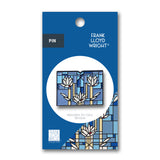Pin with Frank Lloyd Wright design on a blue packaging