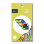 Colorful geometric pin on a yellow card with Frank Lloyd Wright branding