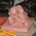Boulder Paperweight shown next to pencils.