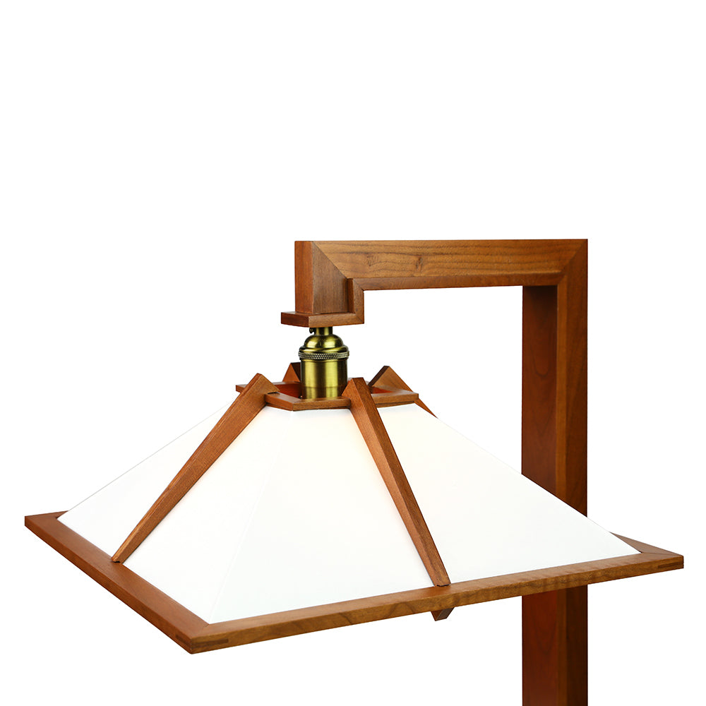 Image focuses on lamp shade, cherry stain.